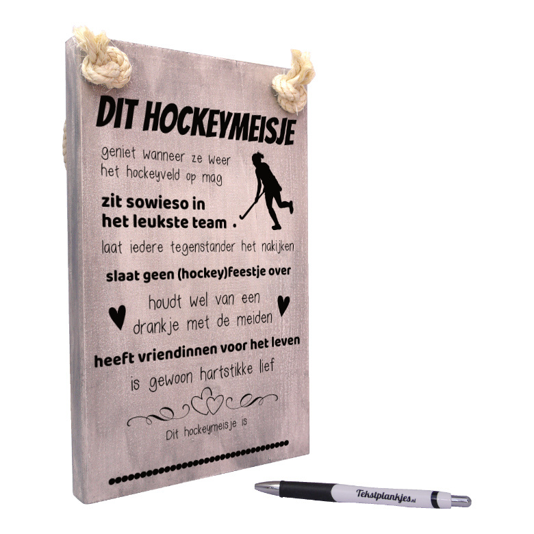 Tekst op hout tekstbord - dit hockeymeisje geniet